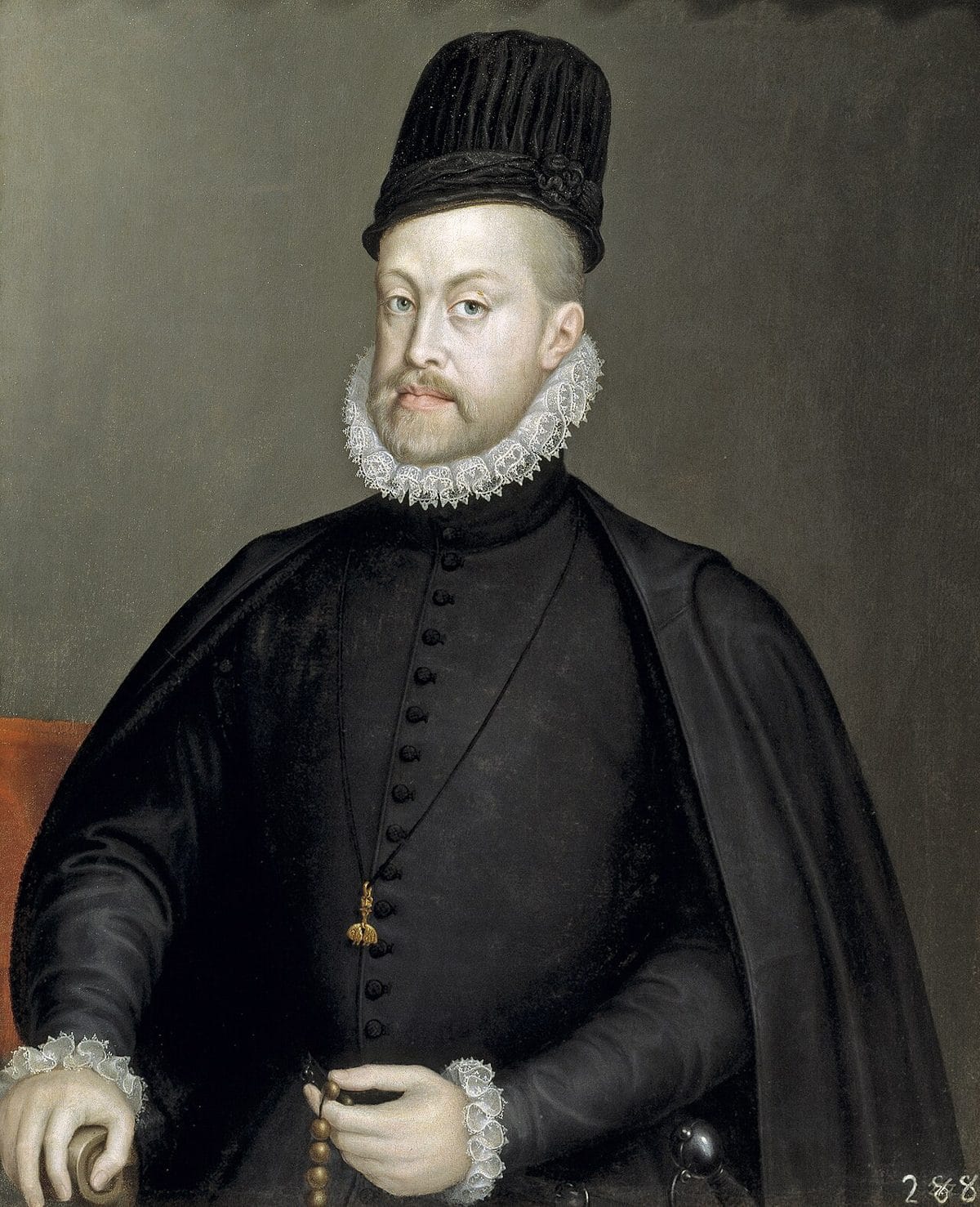 Portrait of King Philip II of Spain in a black buttoned doublet with a small lace-edged ruff and a black cape