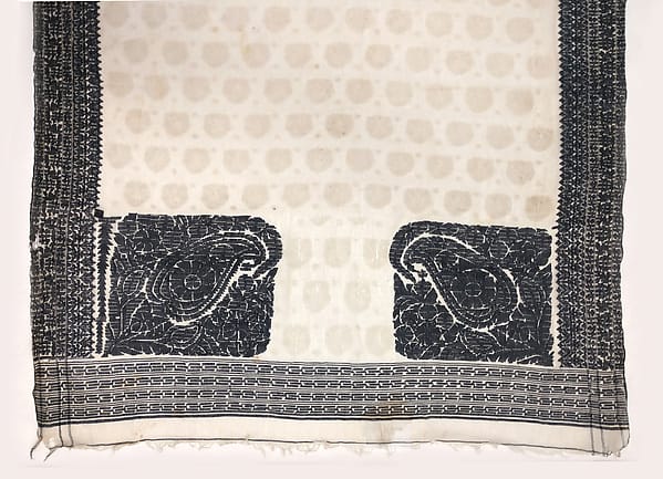 Sari-length white muslin with dark woven borders and two large paisley motifs at one end, with small pale motifs scattered over the field