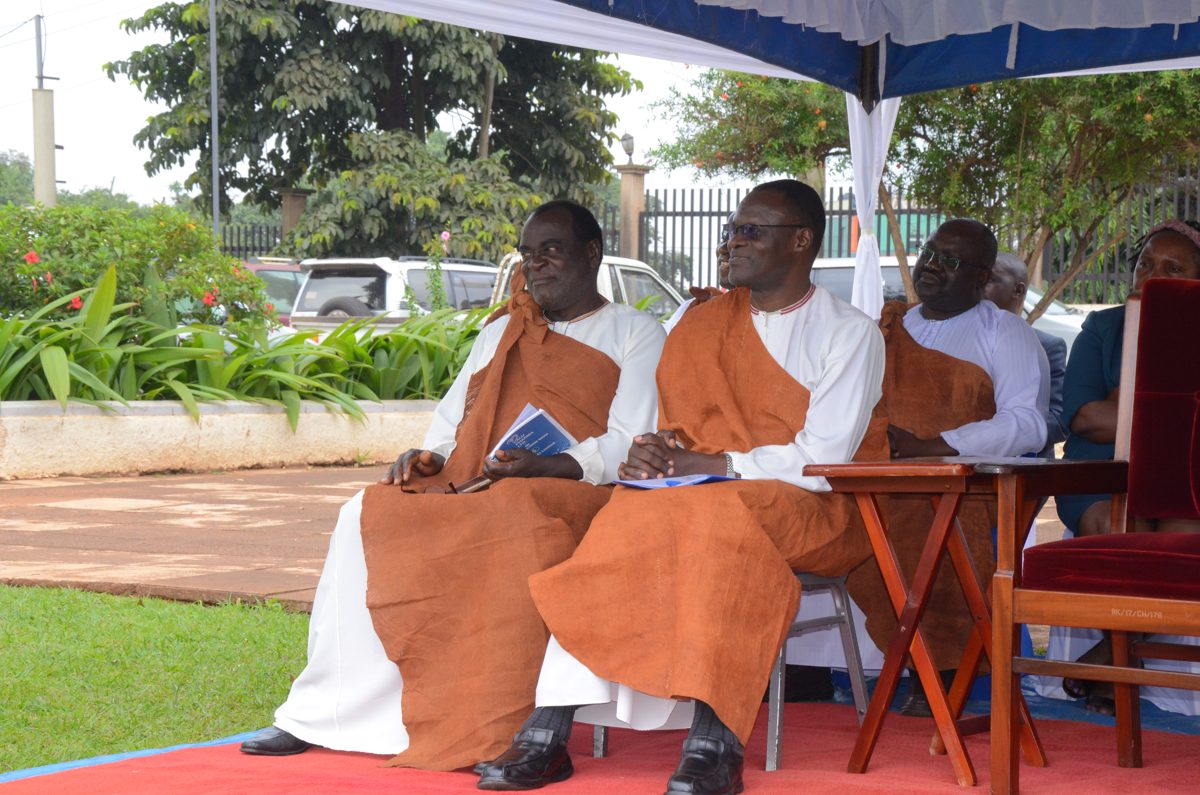 Men wearing Buganda barkcloth over white robes at a Buganda kingdom ceremony, Uganda, 2025