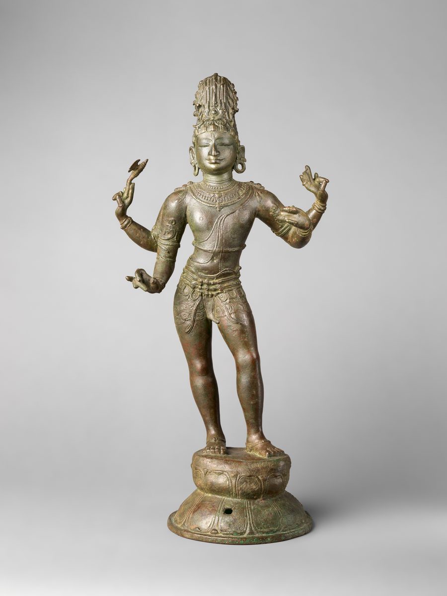Chola bronze of a four-armed Shiva wearing a short lower garment, jewelled girdle, armlets, necklaces, and earrings