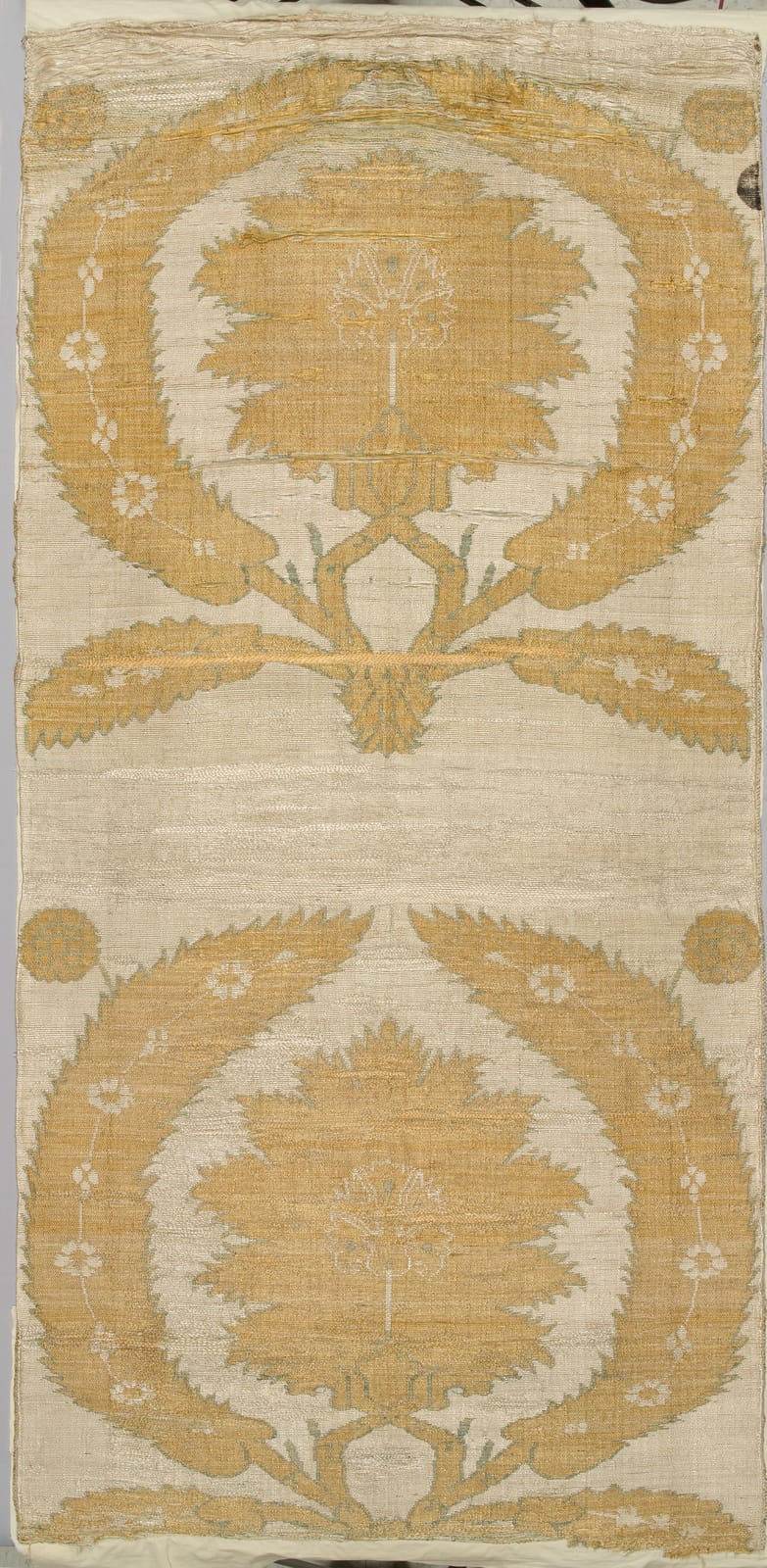 Ottoman kaftan panel of ivory silk woven with large gold carnation-like blossoms inside curving leaf medallions